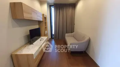 Modern living room with sleek wooden furniture and cozy sofa