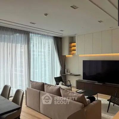 Modern living room with large windows and elegant decor in a luxury apartment.
