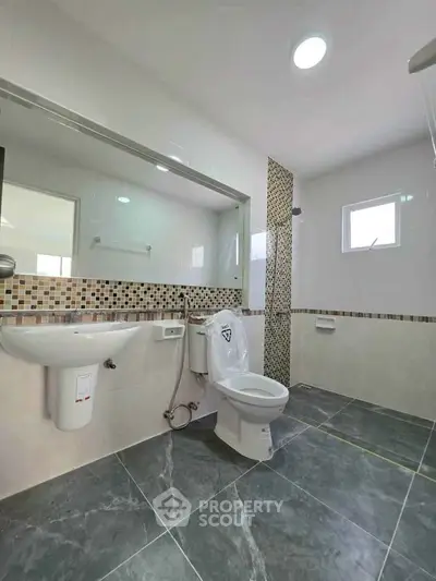 Modern bathroom with stylish tile design and sleek fixtures