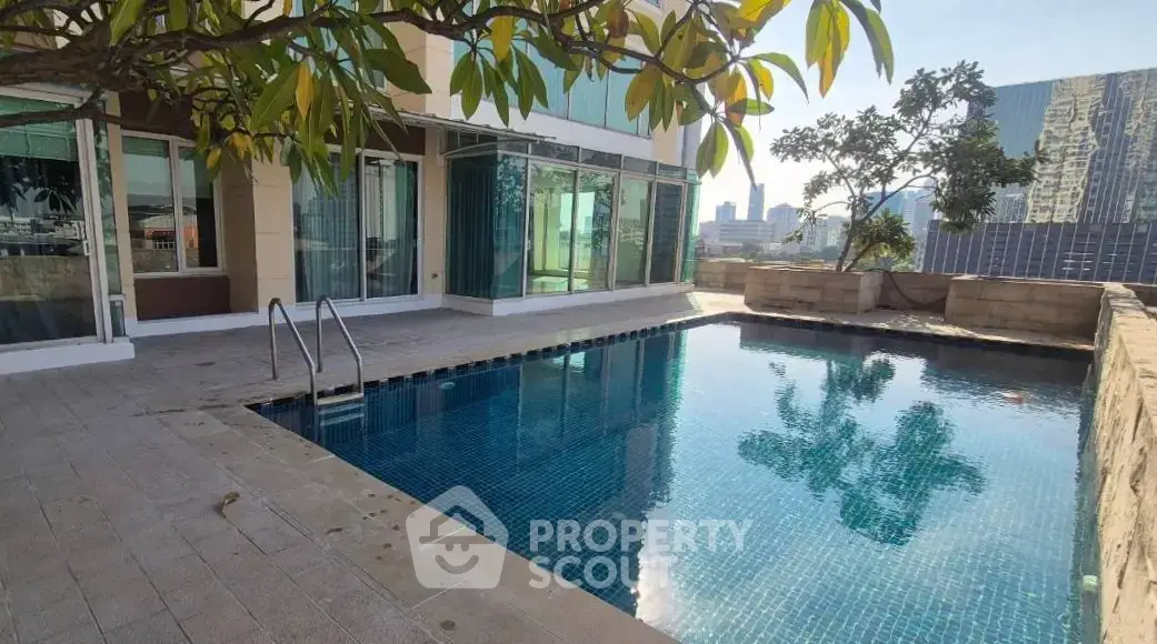 Luxurious rooftop pool with stunning city views and modern design, perfect for relaxation and entertainment.