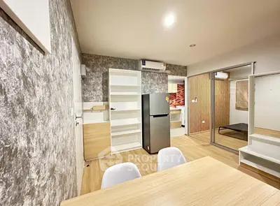 Modern open-plan living area with stylish decor and sleek appliances