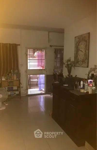 Cozy living room with decorative wall art and natural light