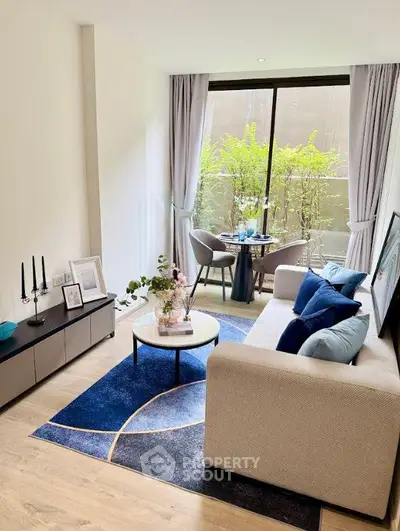 Modern living room with stylish decor and large window view