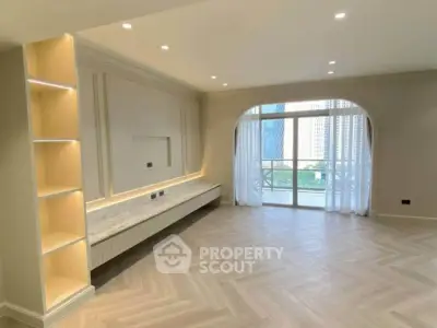 Spacious modern living room with elegant flooring and large windows offering city views.