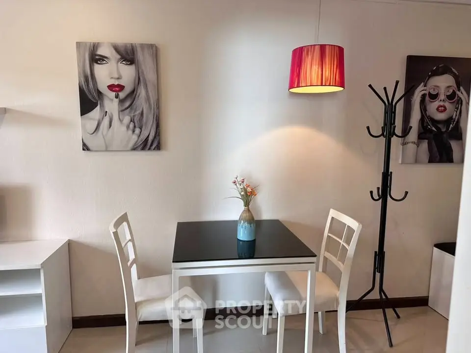 Chic dining area with modern decor and stylish artwork, perfect for intimate meals.