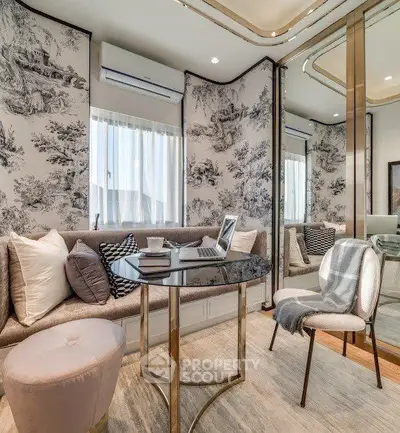 Elegant living room with stylish decor and modern furniture, featuring a cozy seating area and chic wallpaper.
