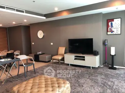 Spacious modern living room with stylish decor and entertainment setup
