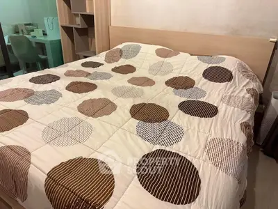 Cozy bedroom with modern decor and stylish bedding in a serene setting.