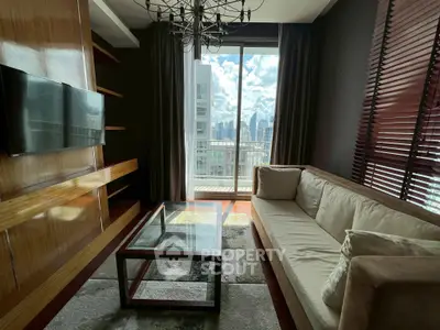 Stylish living room with modern decor and city view from balcony.