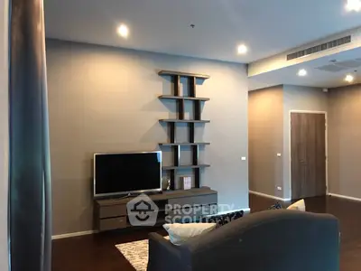 Modern living room with sleek TV unit and stylish shelving, perfect for contemporary living.