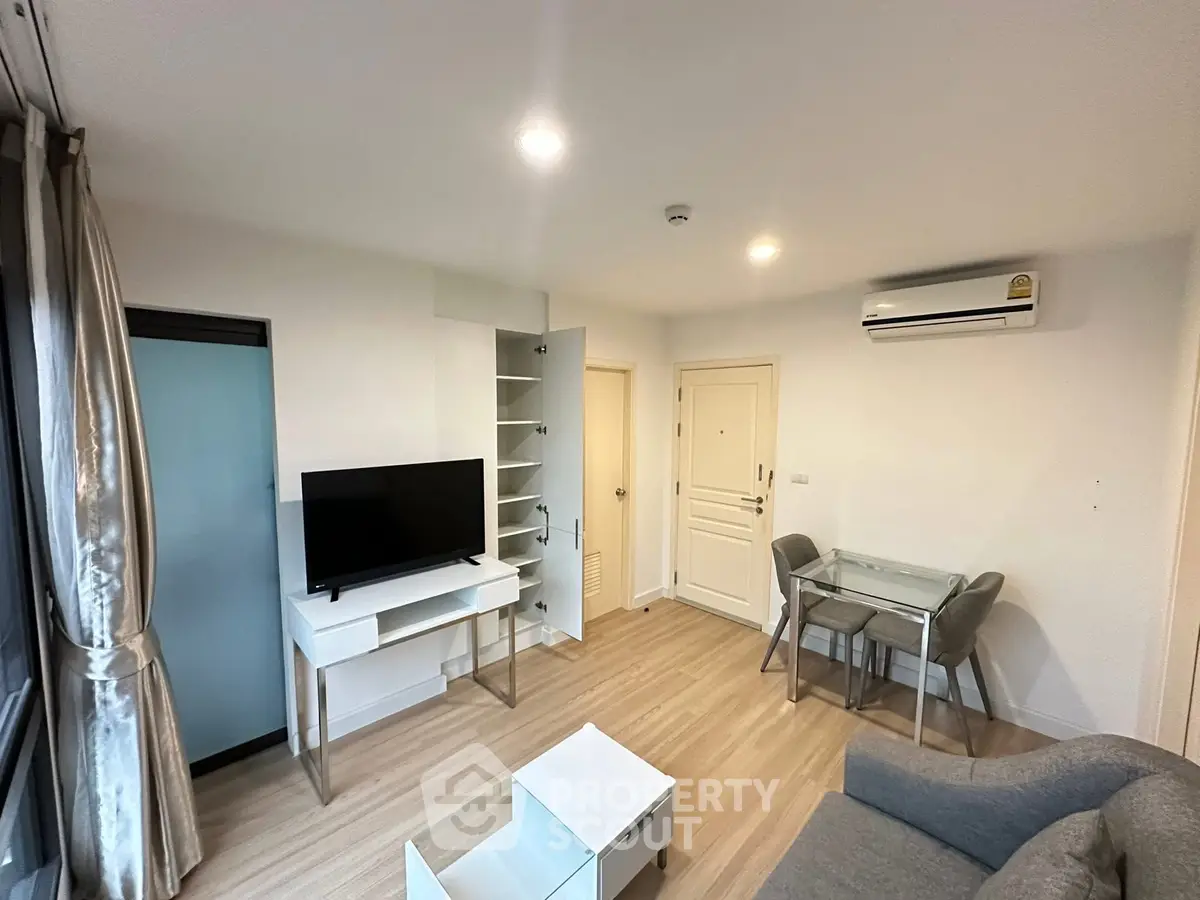 Modern living room with sleek furniture and air conditioning