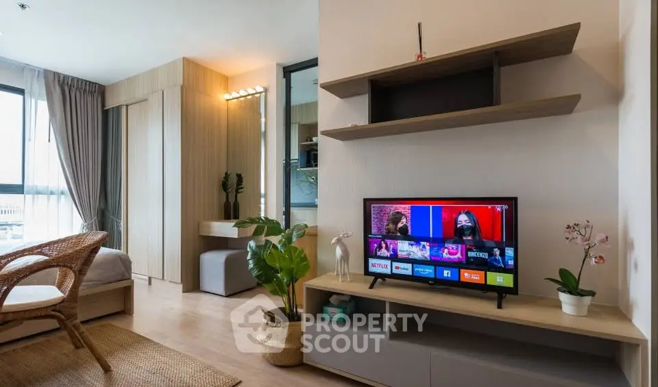 Modern living room with stylish decor and smart TV in a cozy apartment