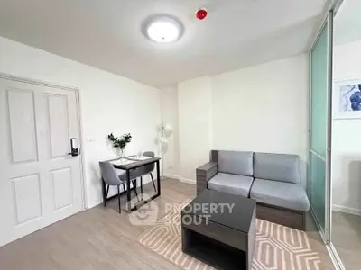 Modern living room with sleek furniture and stylish decor in a contemporary apartment.