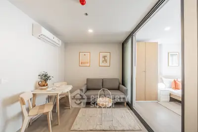 Modern living room with cozy sofa and dining area in stylish apartment