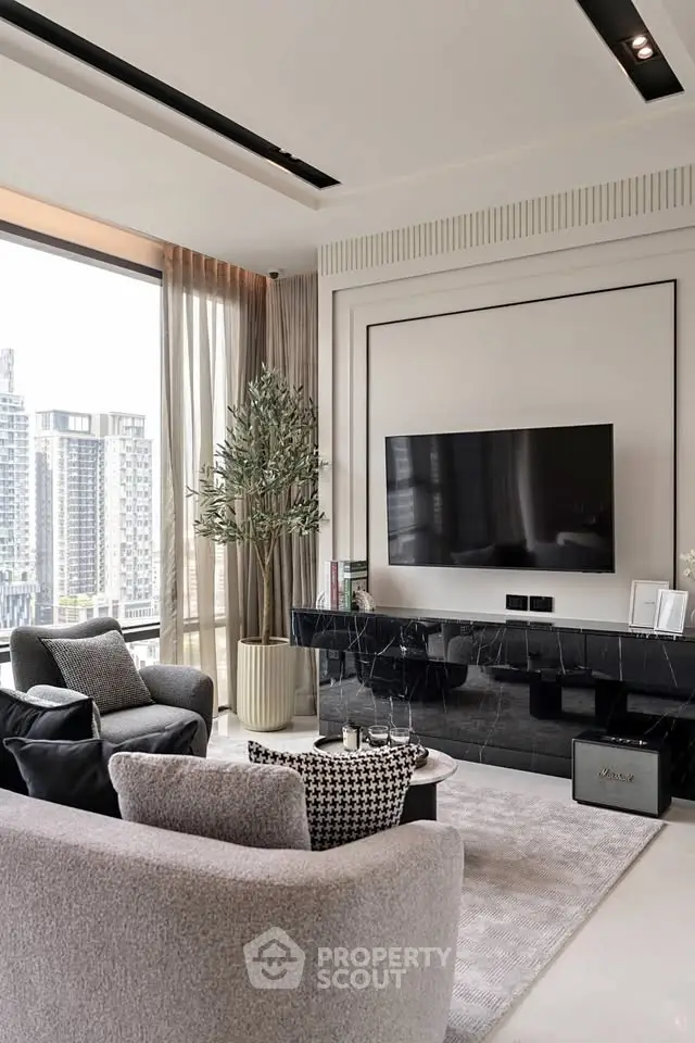 Luxurious modern living room with city view, elegant decor, and large flat-screen TV.