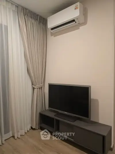 Modern living room with air conditioning and TV setup