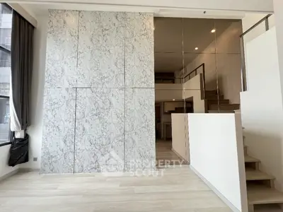 Modern duplex apartment with marble feature wall and stylish staircase