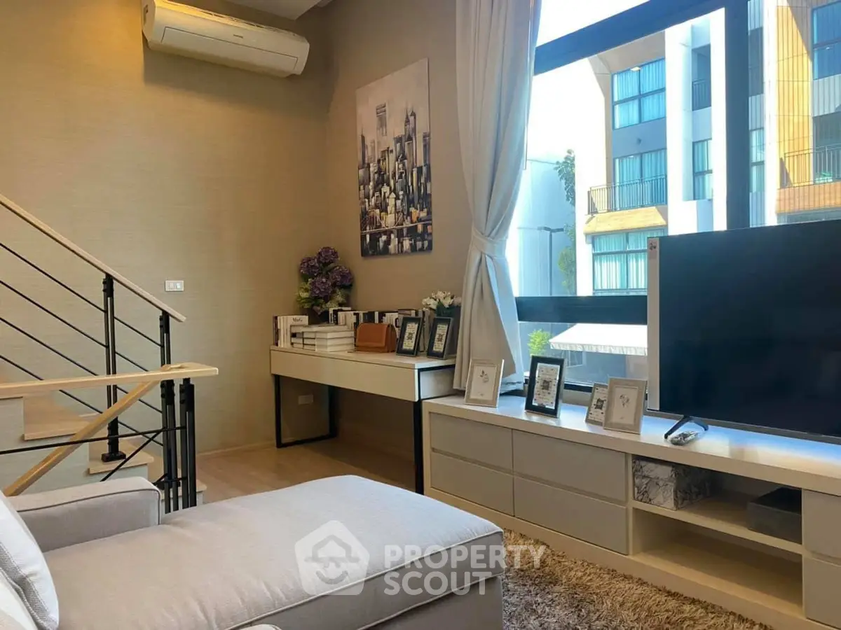 Stylish living room with modern decor and large window view