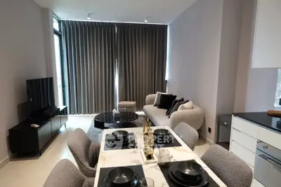 Modern living room with elegant dining area and stylish decor