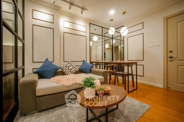 Stylish living room with modern decor and cozy seating area in a contemporary apartment.