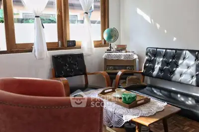 Charming vintage living room with retro furniture and natural light