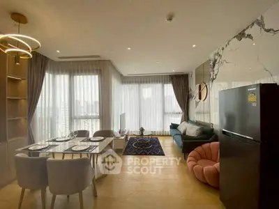 Modern open-plan living room with dining area and stylish decor