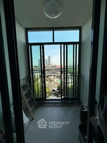 Modern balcony with city view and floor-to-ceiling windows