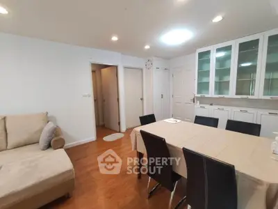 Spacious living room with elegant dining area and modern decor.