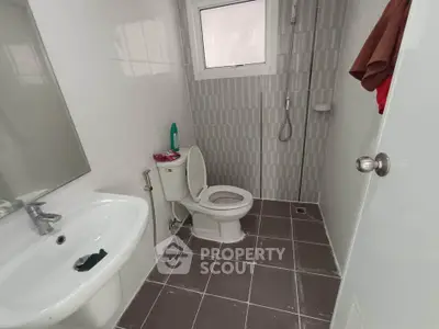 Modern bathroom with sleek fixtures and neutral tile design