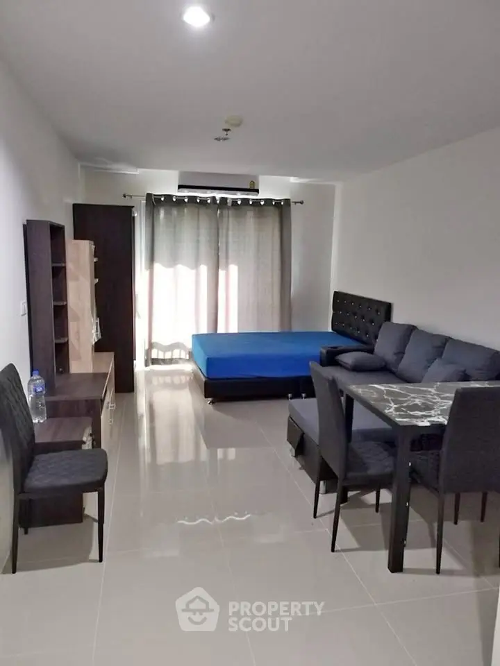 Spacious studio apartment with modern furnishings and natural light