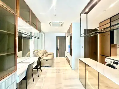 Luxurious modern living room with sleek design and elegant furnishings in a high-end apartment.