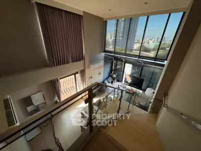 Luxurious duplex living room with stunning city view and modern decor