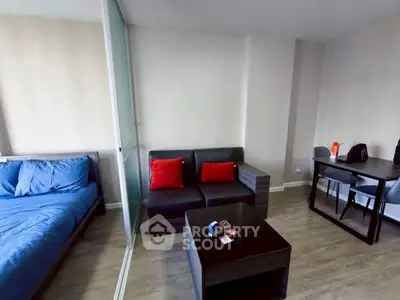 Modern studio apartment with cozy living area and stylish decor