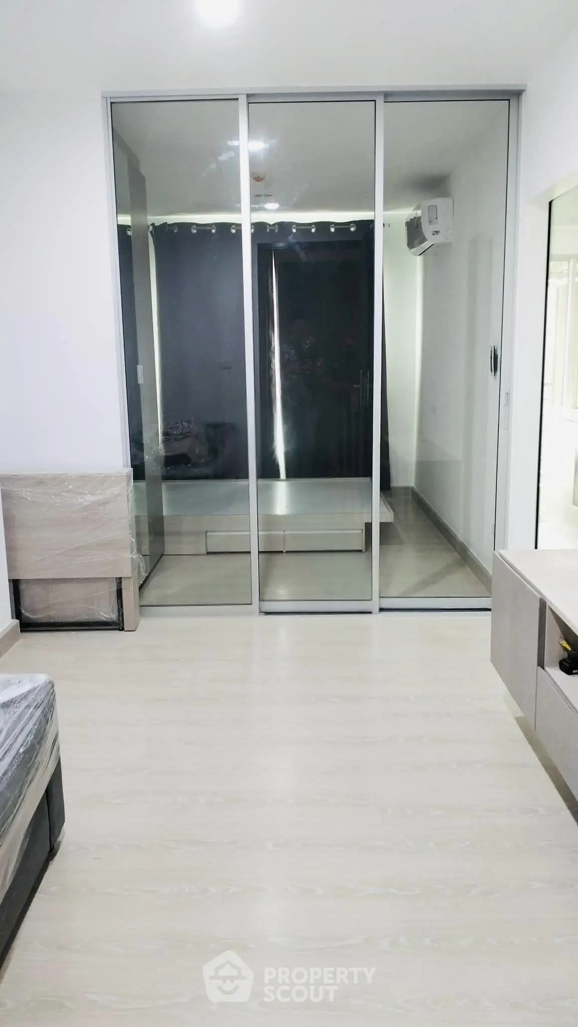 Modern bedroom with sliding glass doors and minimalist design