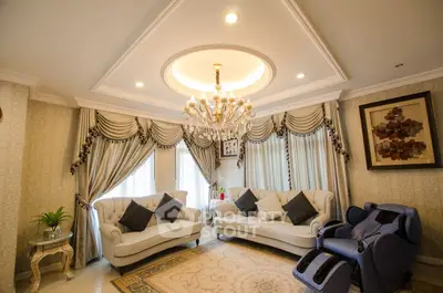 Luxurious living room with elegant chandelier and plush seating