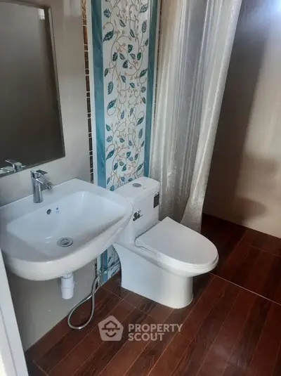 Modern bathroom with elegant tile design and sleek fixtures