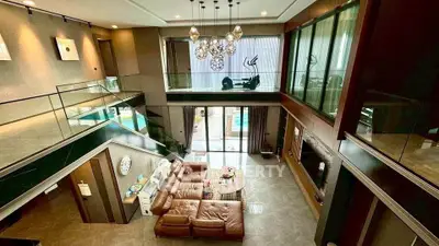 Luxurious modern living room with high ceilings and elegant decor