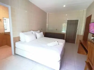 Spacious bedroom with modern decor and ensuite bathroom