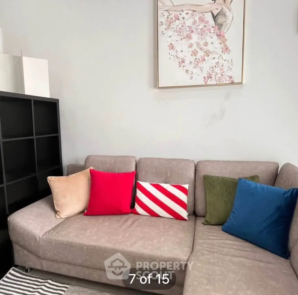 Cozy living room with stylish sectional sofa and colorful cushions, perfect for relaxation and modern living.