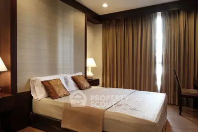 Elegant bedroom with cozy lighting and stylish decor, featuring a comfortable bed and warm ambiance.
