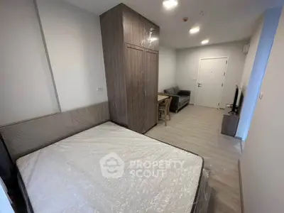 Modern studio apartment with cozy living area and stylish furnishings