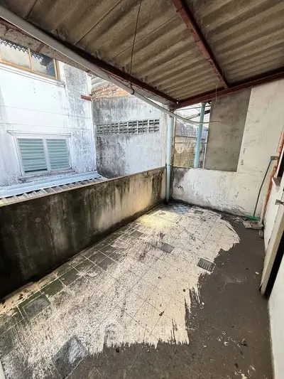 Spacious balcony with potential for renovation in urban setting