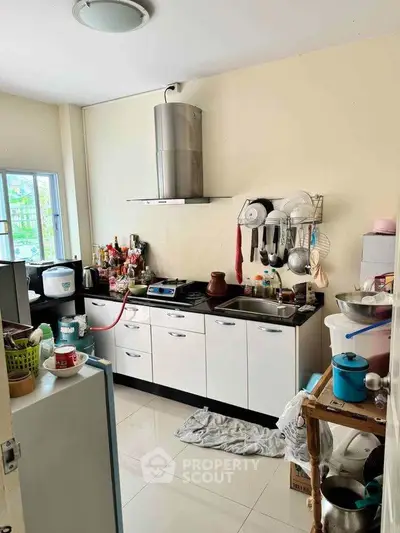 Cozy kitchen with modern appliances and ample storage space.