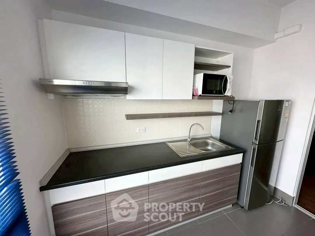 Modern kitchen with sleek cabinetry and stainless steel appliances