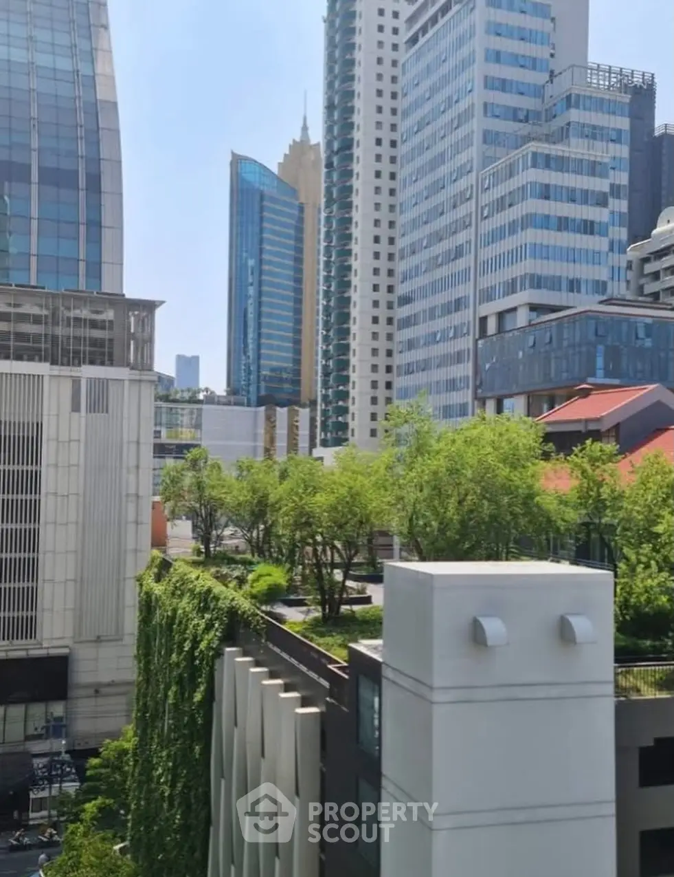 Stunning urban view with modern skyscrapers and lush rooftop gardens.