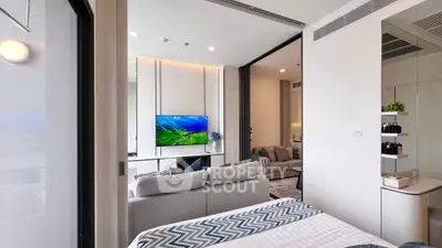 Modern open-plan living room with stylish decor and natural light