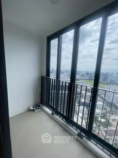 Stunning high-rise balcony with panoramic city views, perfect for urban living.