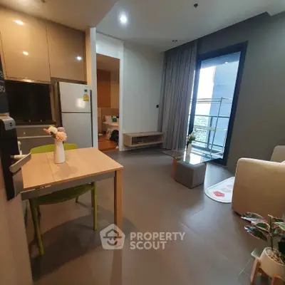 Modern open-plan living room with balcony and stylish decor