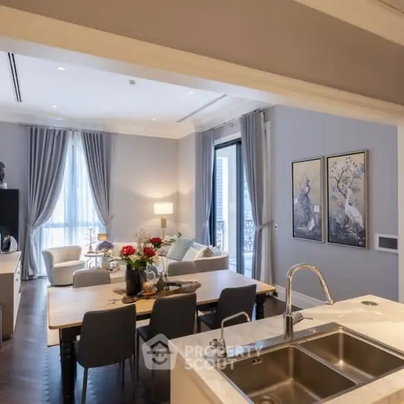 Luxurious open-plan living room with elegant decor and modern kitchen