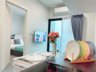 Modern apartment interior with stylish kitchen and cozy bedroom view